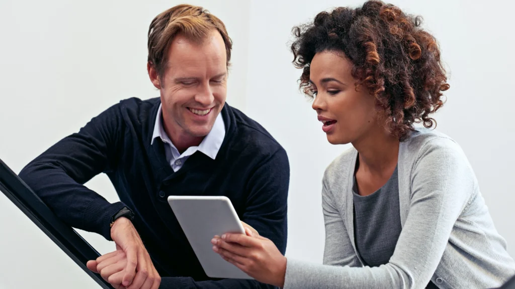 Colleagues discussing their financial communication plan with GlobalMeet