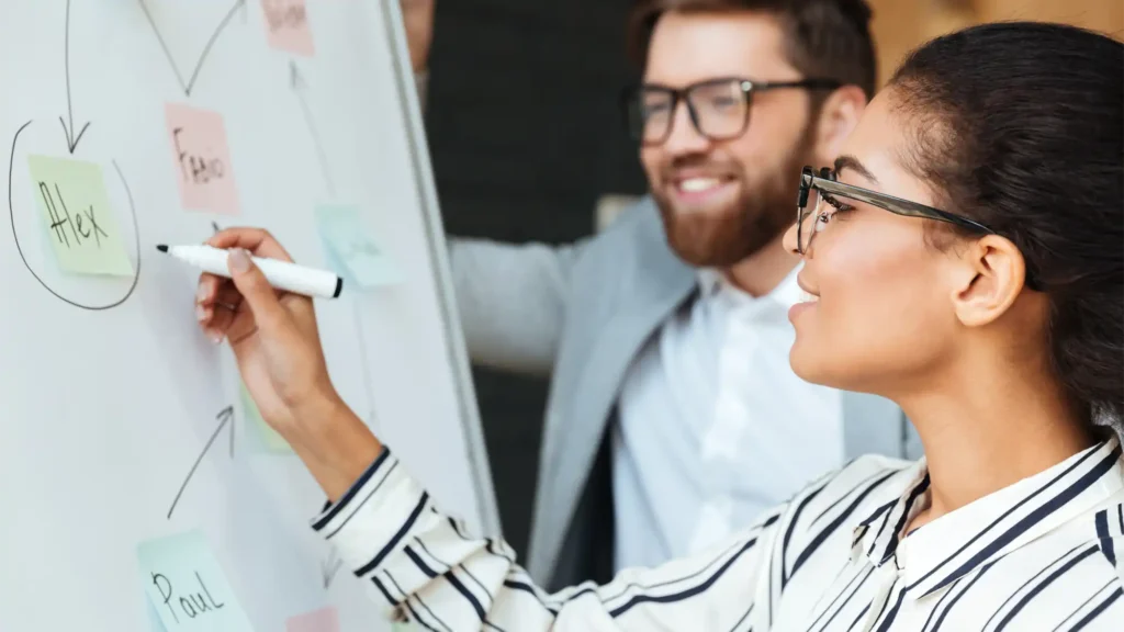 two business people planning to use a self-service virtual event software for their event marketing strategy