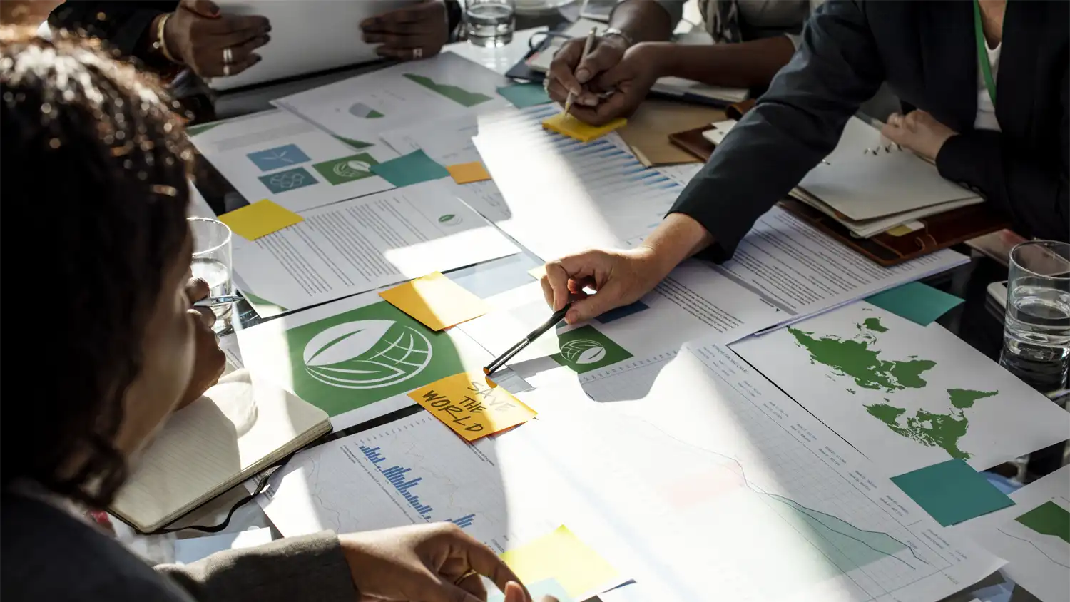 a group of professionals plan their sustainable event strategy