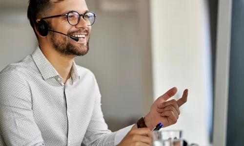 happy-agent-using-computer-while-communicating-with-clients