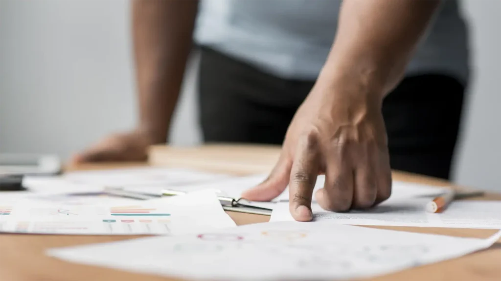 image of a business man looking over analytics as he plots his virtual event plan